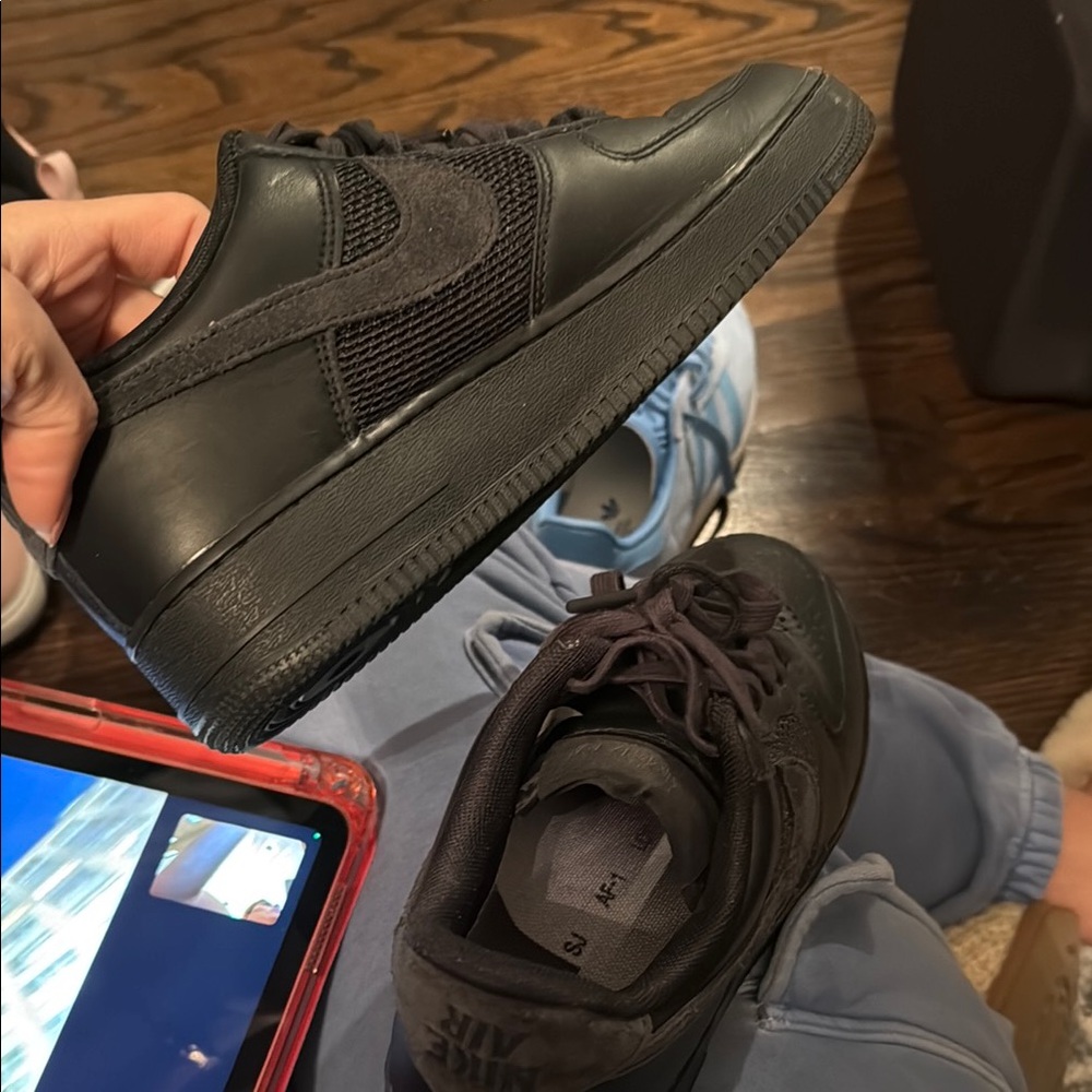 Nike Black Sneakers with Smooth Leather Upper and Thick Rubber Sole